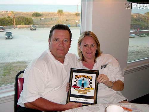 Cindy and Henry with winning plaque.jpg